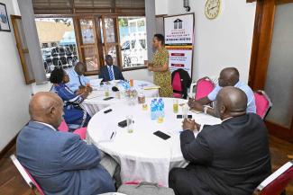 Col. Edith Nakalema addresses academicians in a meeting organised to find lasting solutions to the recurring burden of youth unemployment in Uganda.